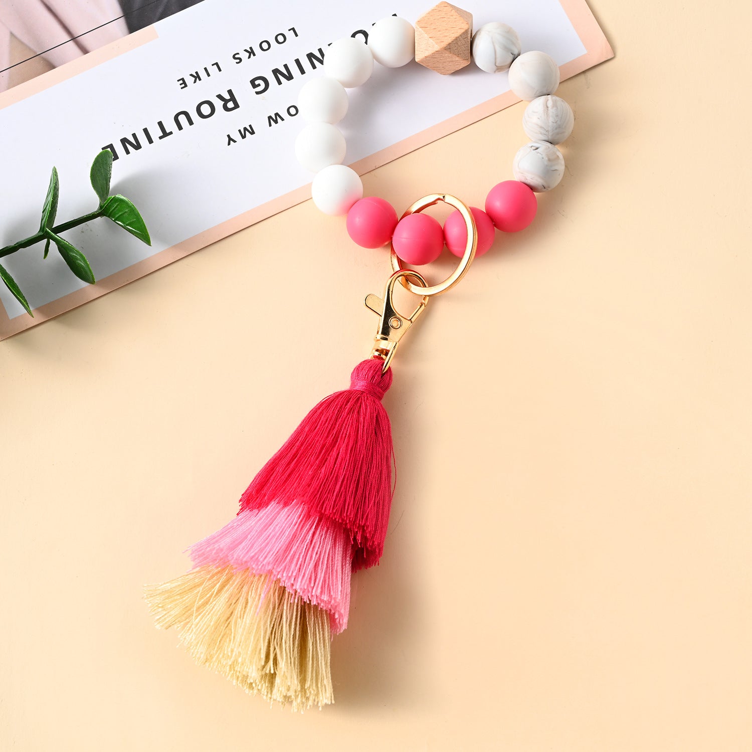 Venta al por mayor Llavero de la pulsera del grano del silicón de la borla