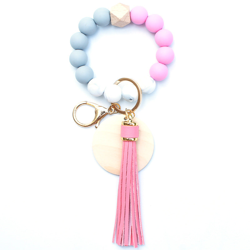 Llavero de muñeca de cuentas de madera con borla de silicona al por mayor