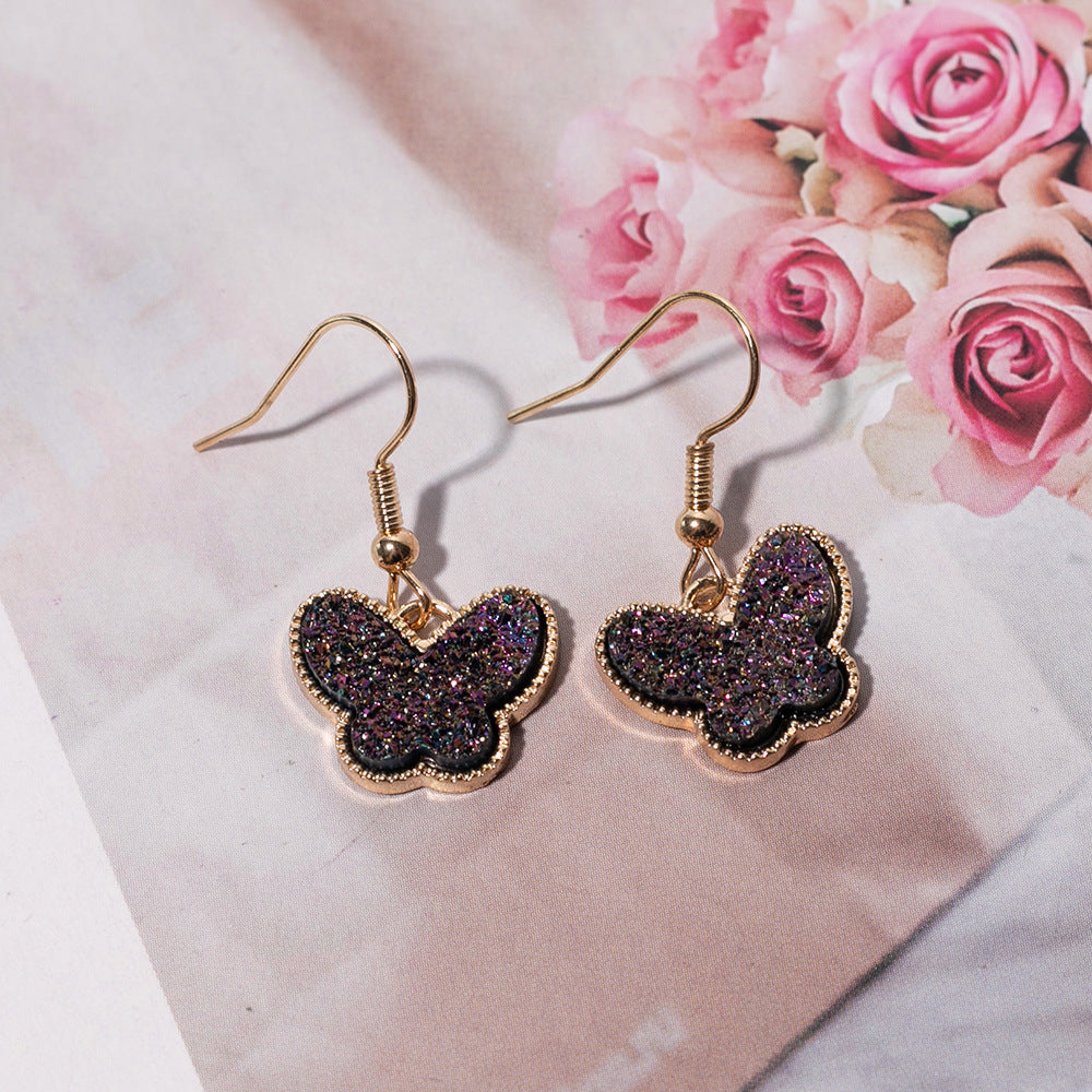 Pendientes de aleación de mariposa de resina de color de joyería al por mayor