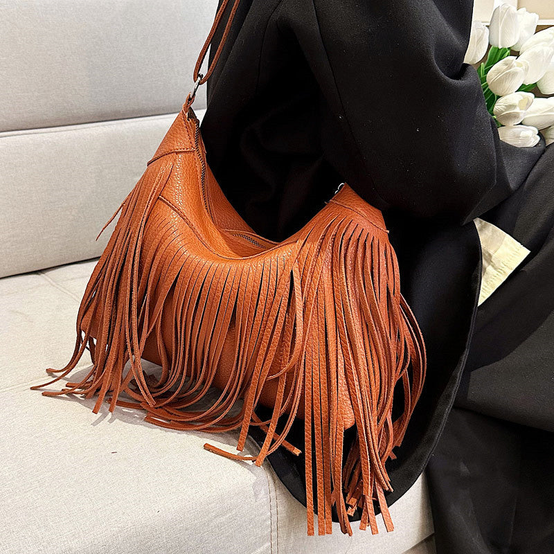 Venta al por mayor Bolso de cubo diagonal con borla de PU