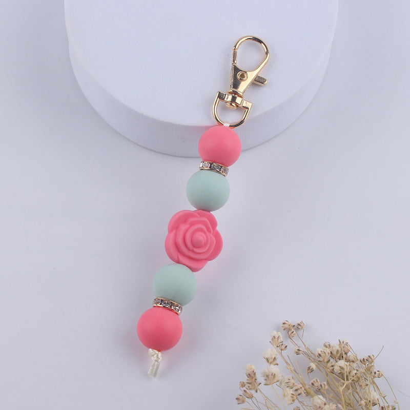 Llavero con cuentas de silicona rosa de doble cara al por mayor