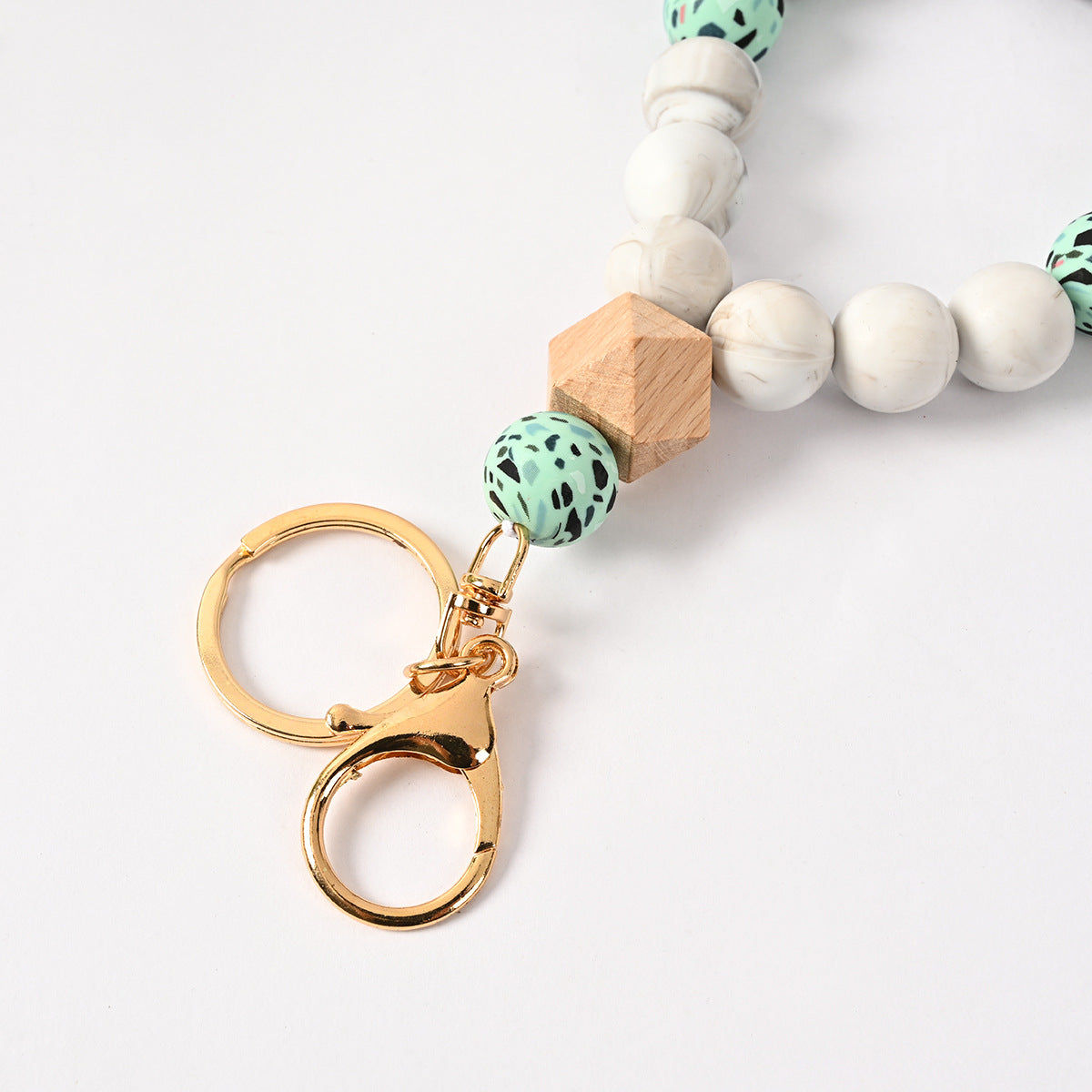 Venta al por mayor Llavero de la pulsera del grano del silicón de la borla