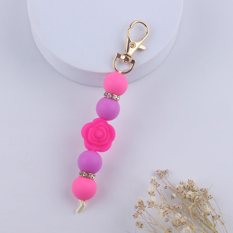 Llavero con cuentas de silicona rosa de doble cara al por mayor