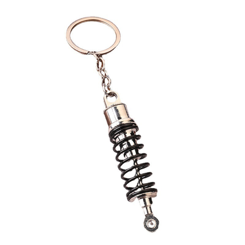 Venta al por mayor Llavero creativo del amortiguador de choque del metal