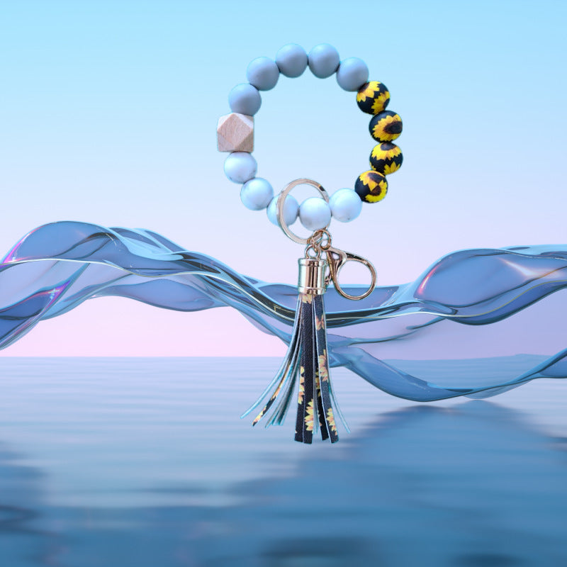 Venta al por mayor Llavero de muñeca con cuentas de silicona de girasol