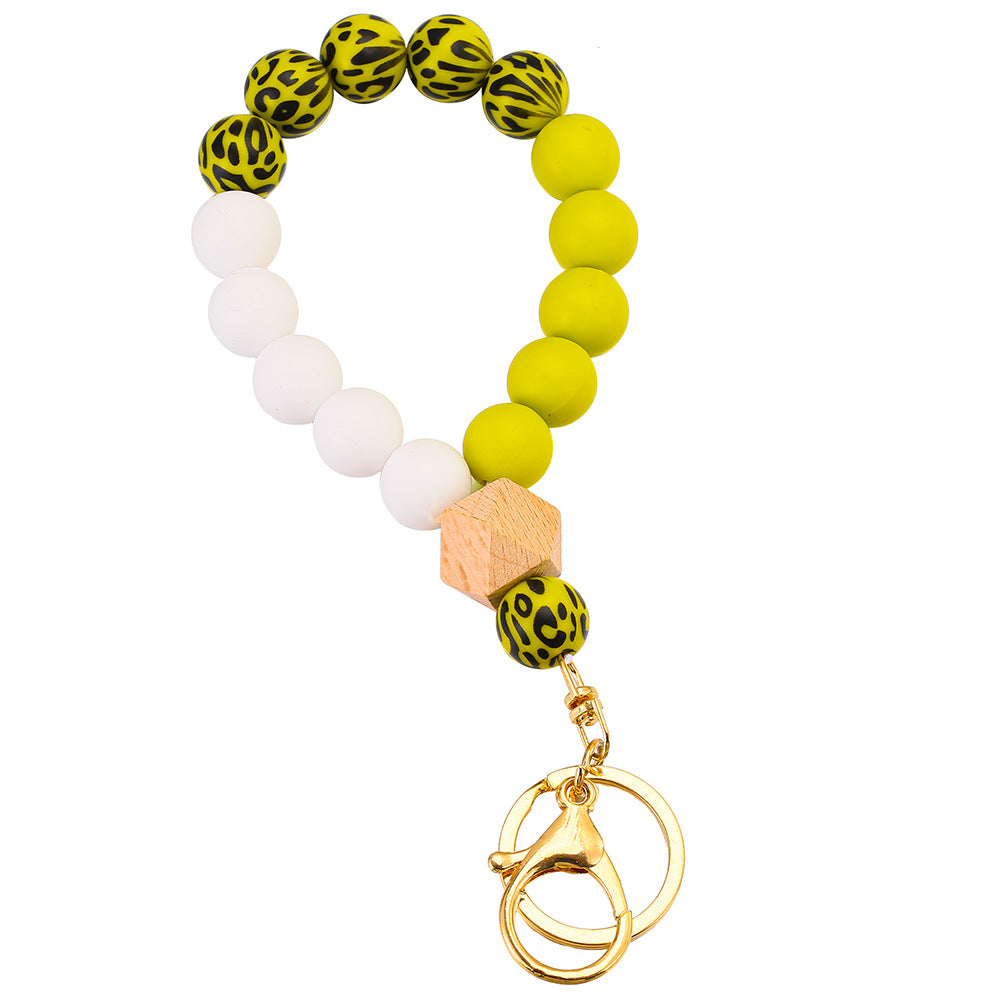 Llavero de muñeca con cuentas de madera de leopardo de leopardo.