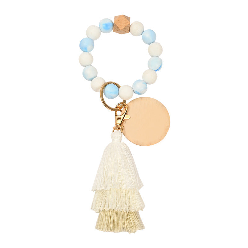 Venta al por mayor Llavero de la pulsera del grano del silicón de la borla