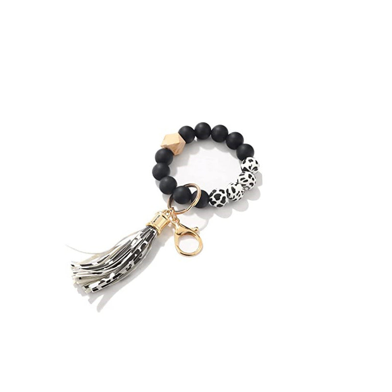 Llavero al por mayor de la muñeca de la mano de la borla del cuero del cordón del silicón del estampado de leopardo