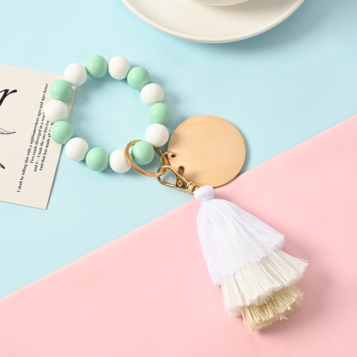 Venta al por mayor Llavero de la pulsera del grano del silicón de la borla