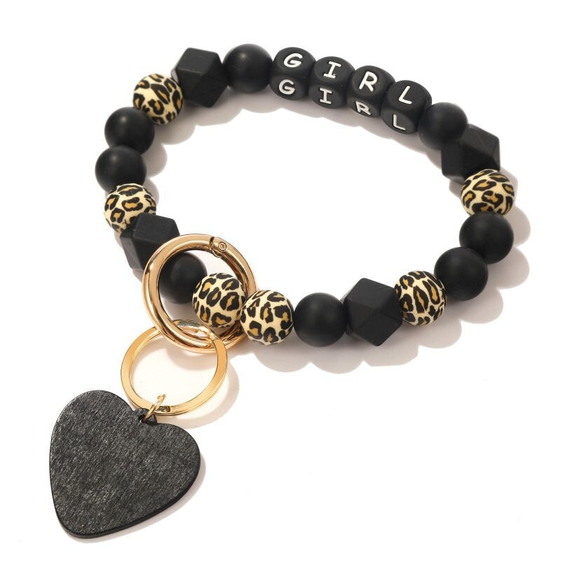 Venta al por mayor, corazón negro, patrón de leopardo, silicona, moldeado, muñeca, llavero