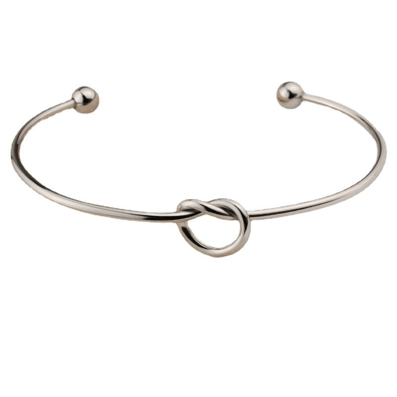 Pulsera De Acero De Titanio Con Corazón Anudado al por mayor