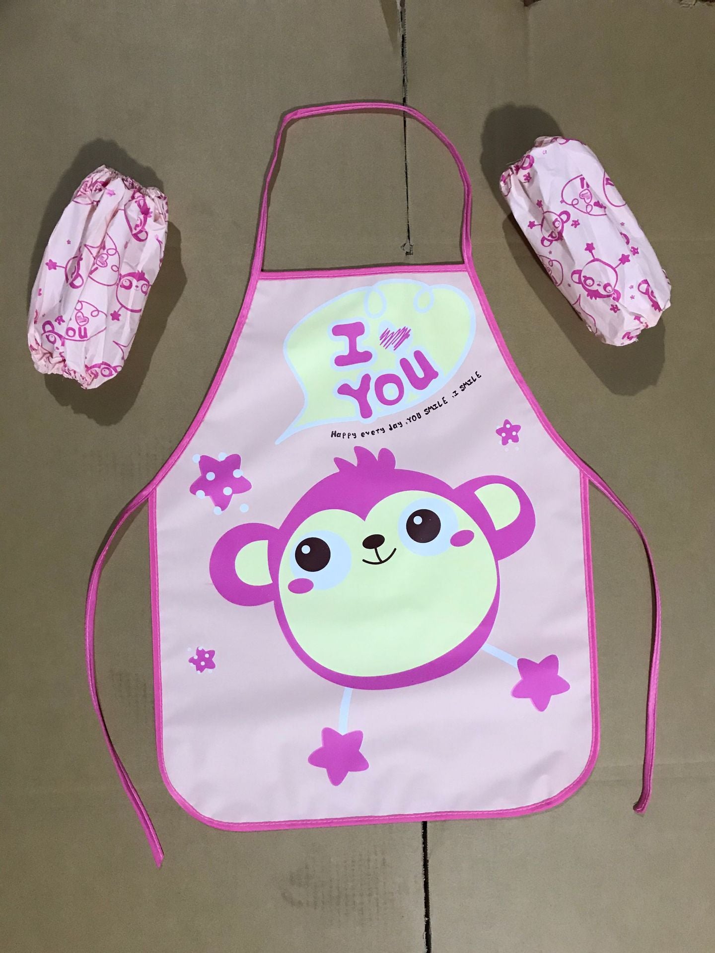 Delantal impermeable al por mayor de los niños de la historieta del PE