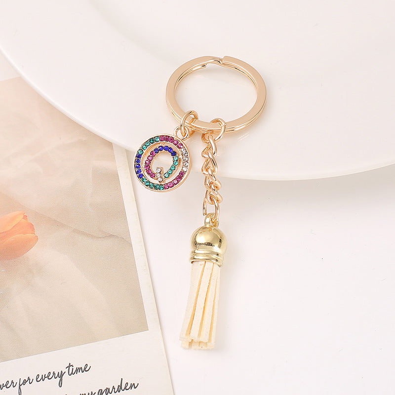 Venta al por mayor Llavero del alfabeto inglés de la borla de la aleación del cinc