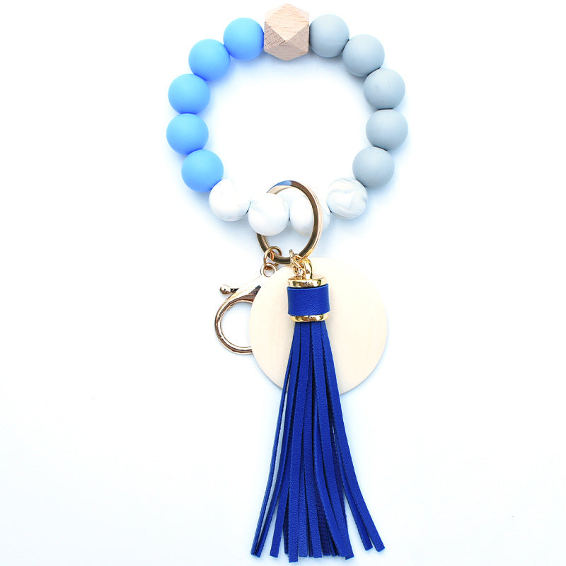 Llavero de muñeca de cuentas de madera con borla de silicona al por mayor