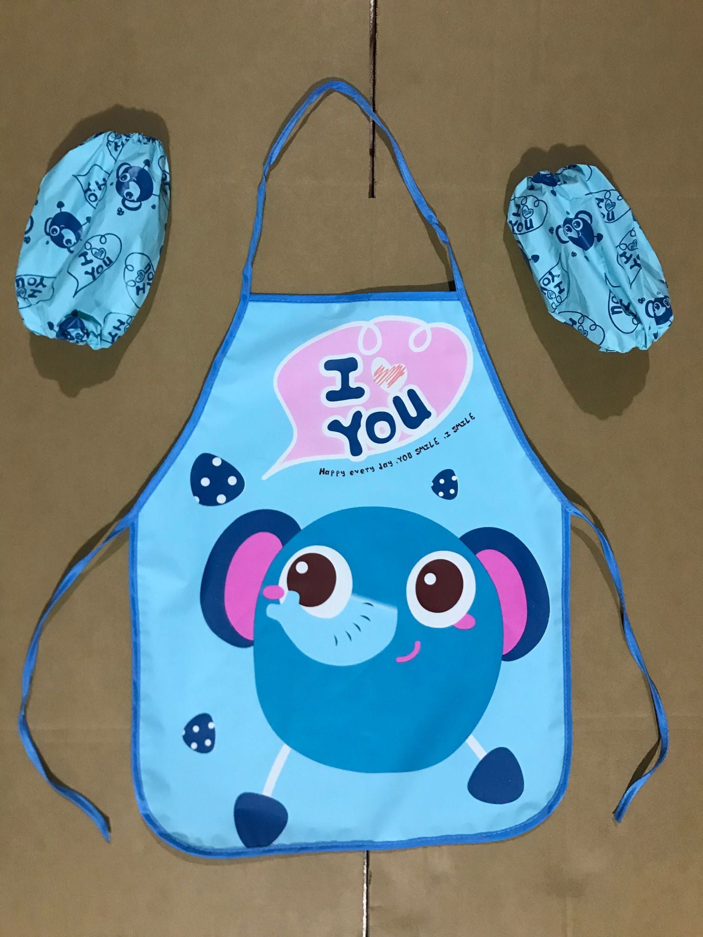 Delantal impermeable al por mayor de los niños de la historieta del PE