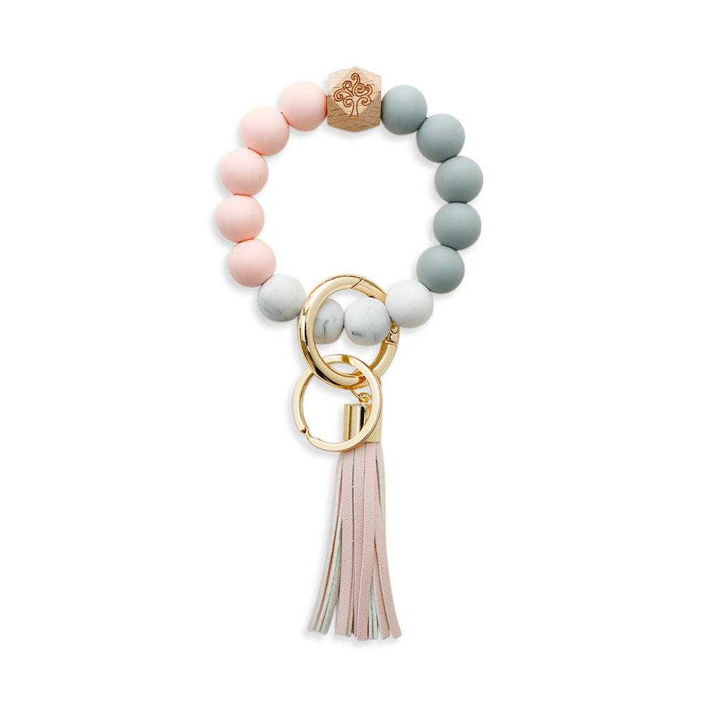 Comercio al por mayor borla de cuero colgante de cuentas de silicona llavero de muñeca