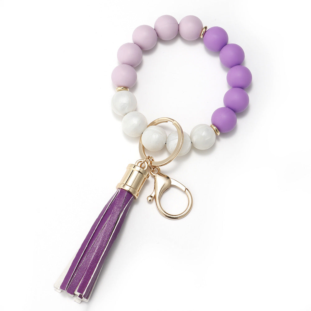 Venta al por mayor Llavero de muñeca de borla con cuentas de silicona
