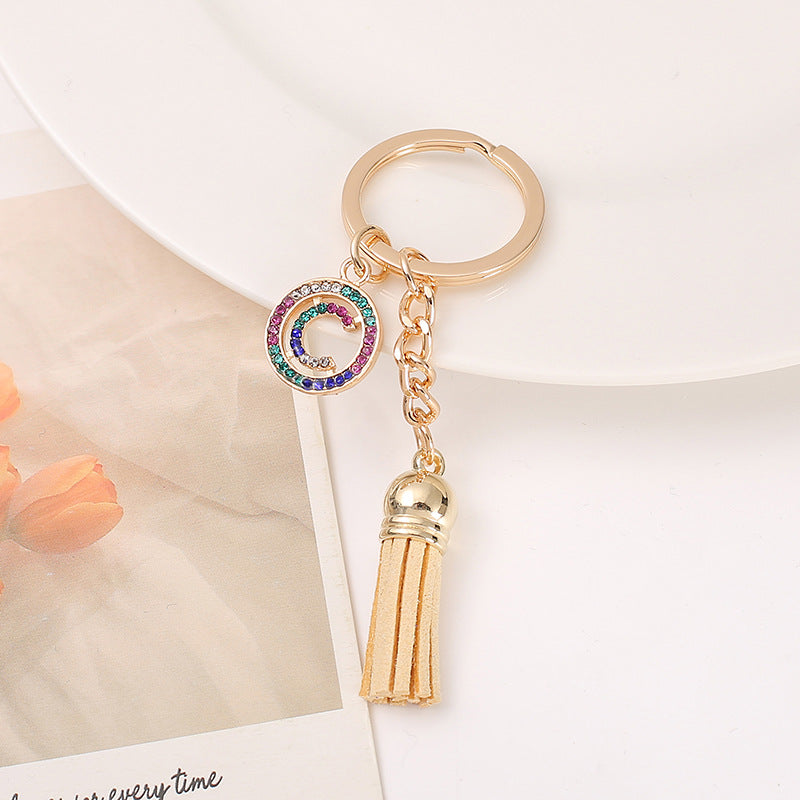 Venta al por mayor Llavero del alfabeto inglés de la borla de la aleación del cinc