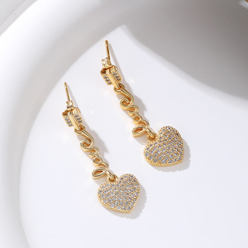 Venta al por mayor Pendientes de cobre con circonitas micro-pavimentadas de oro de 18 quilates con corazón largo