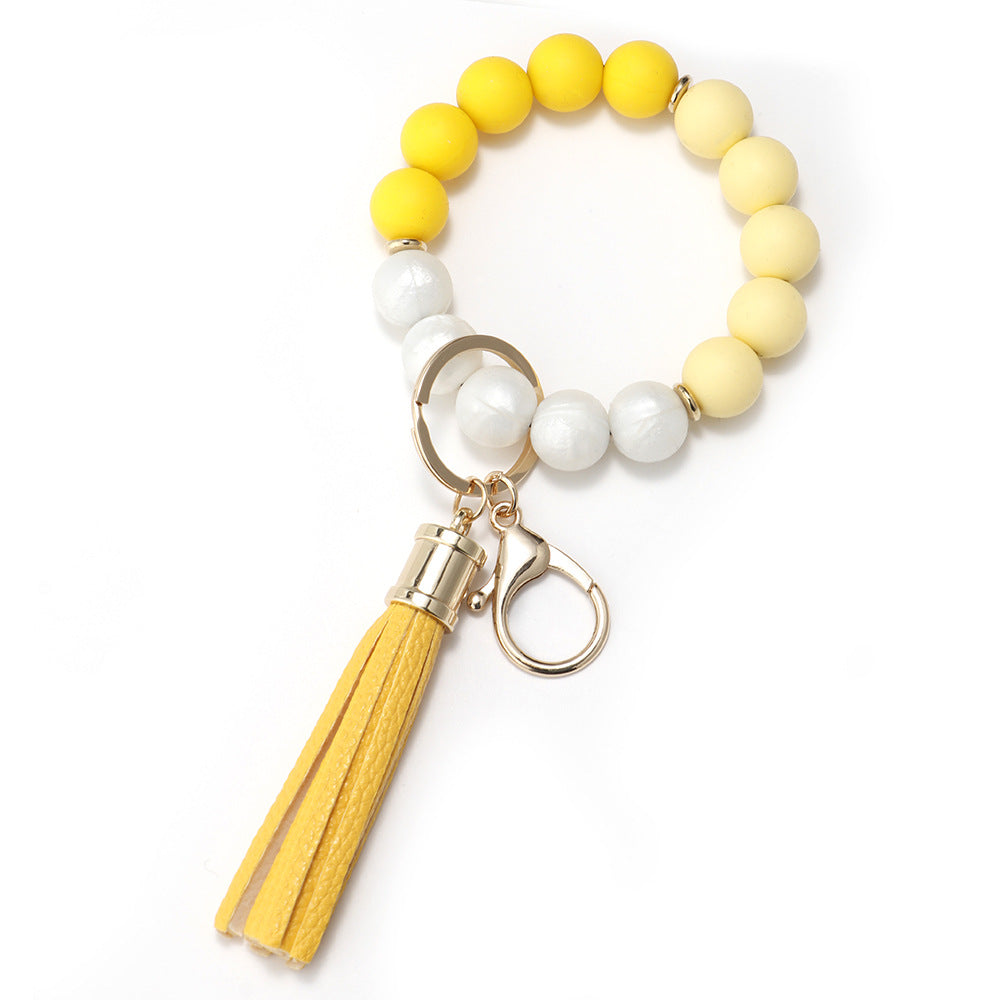 Venta al por mayor Llavero de muñeca de borla con cuentas de silicona