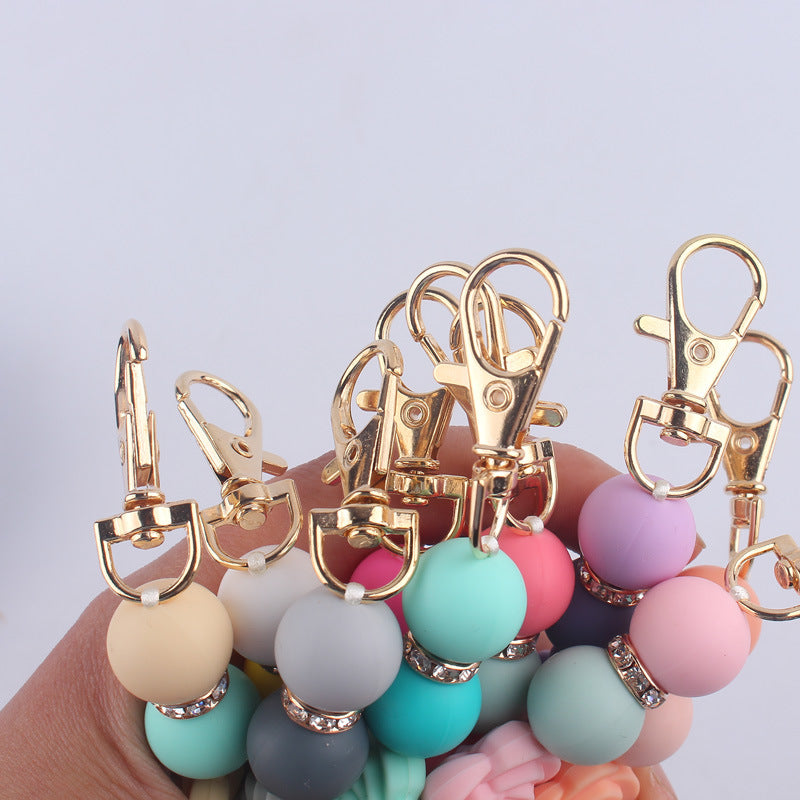 Llavero con cuentas de silicona rosa de doble cara al por mayor