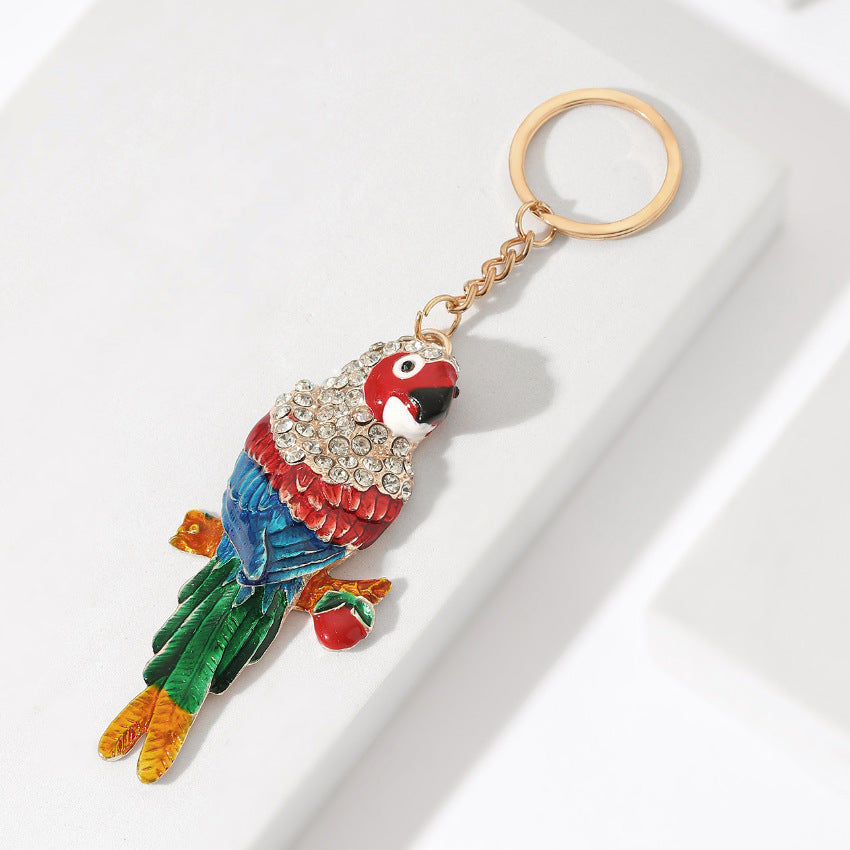 Llavero creativo de loro de metal con incrustaciones de diamantes al por mayor