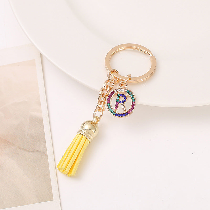 Venta al por mayor Llavero del alfabeto inglés de la borla de la aleación del cinc