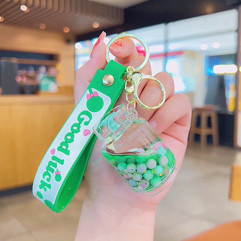 Wholesale Acrylic Green Liquid Into The Oil Quicksand Bottle Series Key Chain