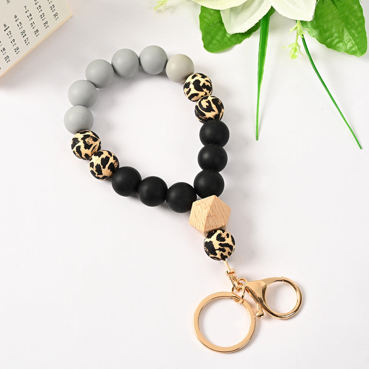 Venta al por mayor Llavero de la pulsera del grano del silicón de la borla