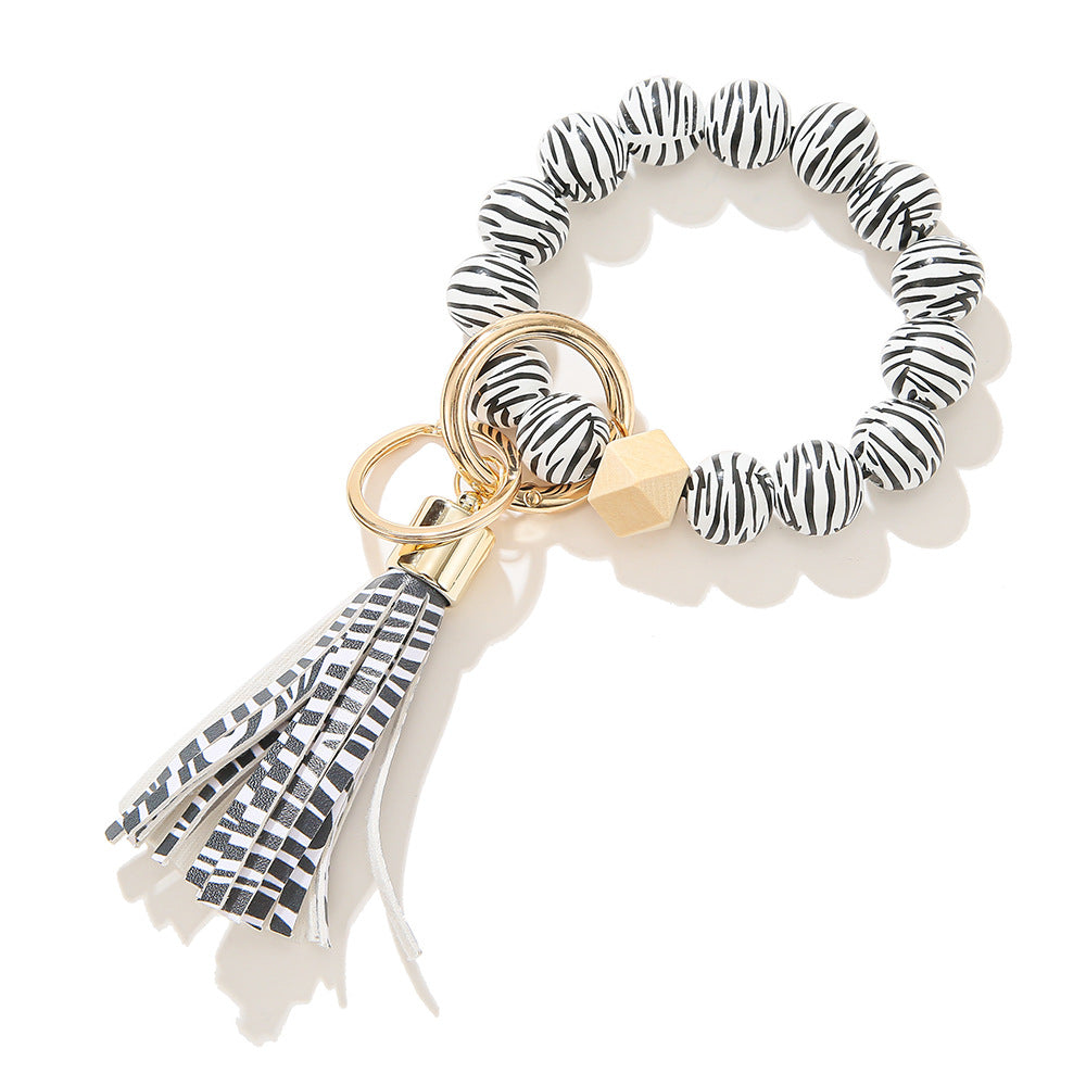 Llavero de muñeca con cuentas de madera con patrón manchado al por mayor