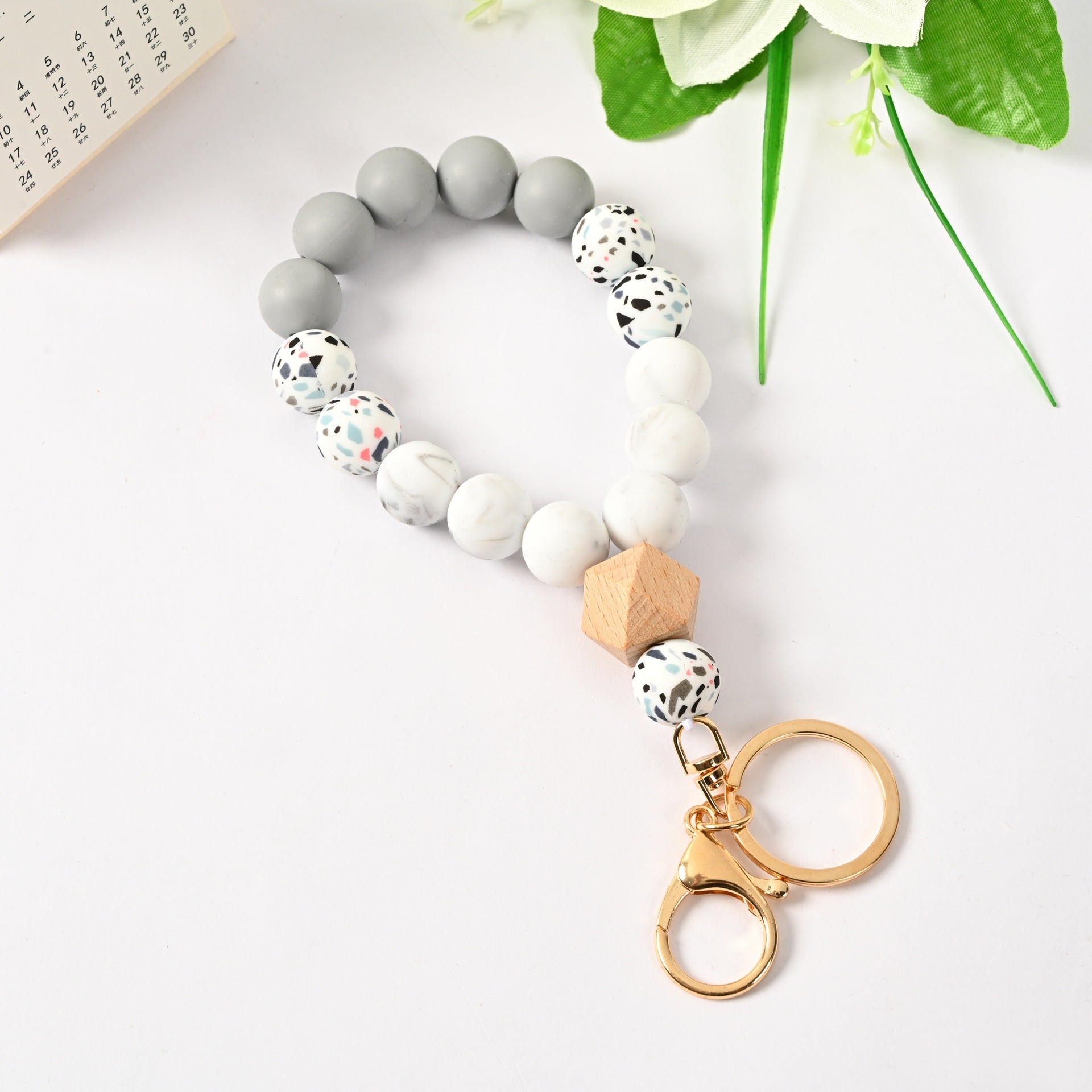 Venta al por mayor Llavero de la pulsera del grano del silicón de la borla