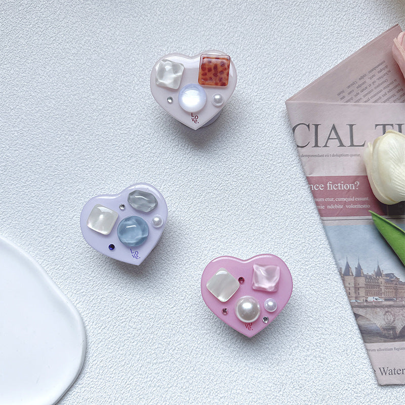 Soporte para teléfono móvil con bolsa de aire de amor de gema de plástico al por mayor