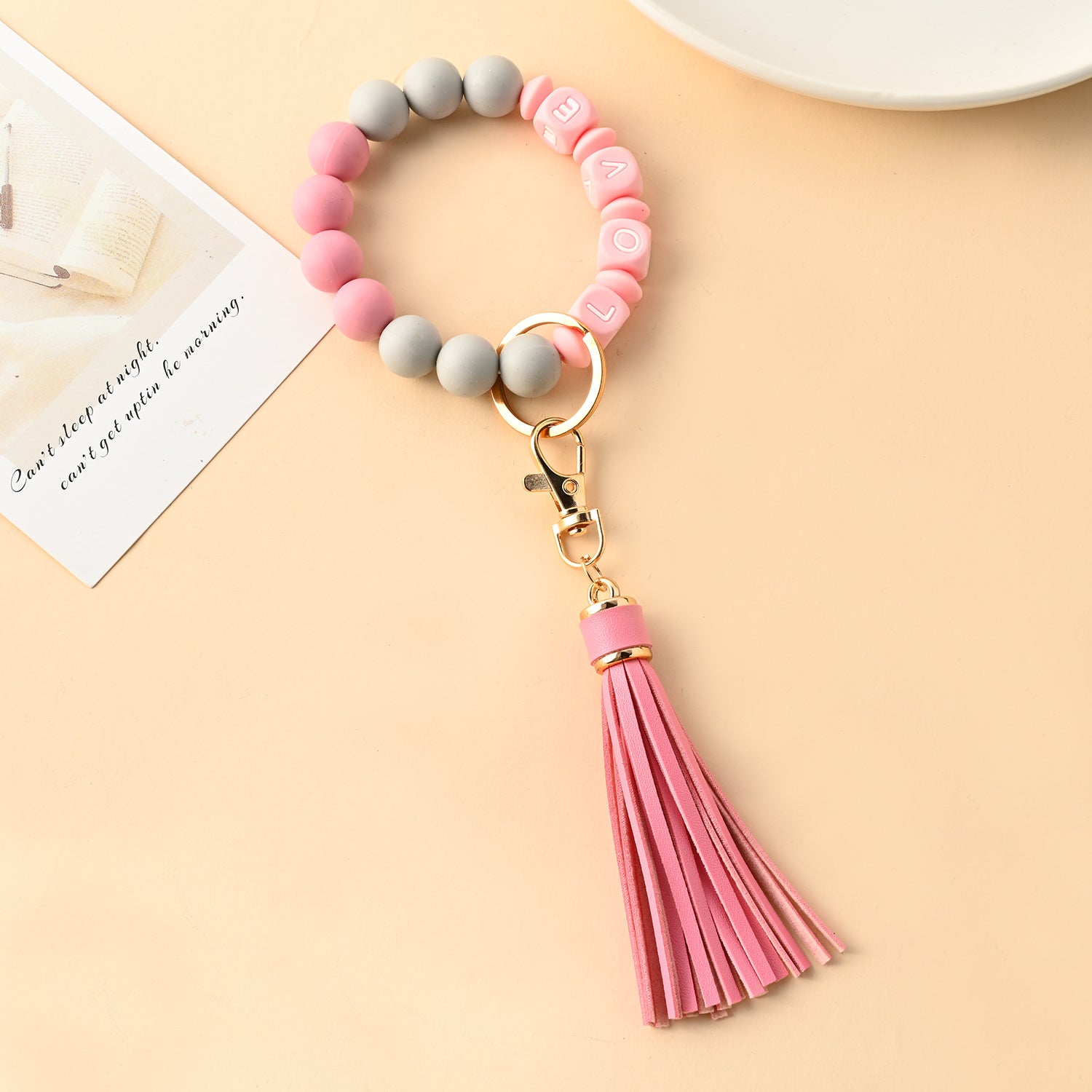 Venta al por mayor Llavero de muñeca con cuentas de silicona borla