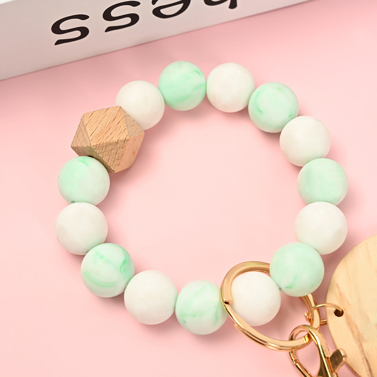 Venta al por mayor Llavero de la pulsera del grano del silicón de la borla