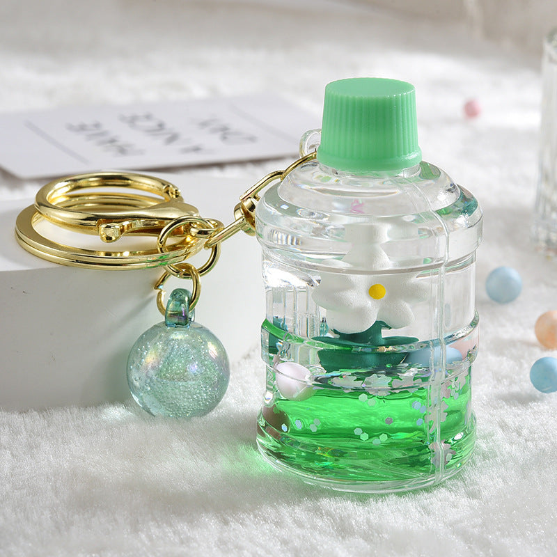 Llavero creativo de flores flotantes aceitadas de acrílico al por mayor