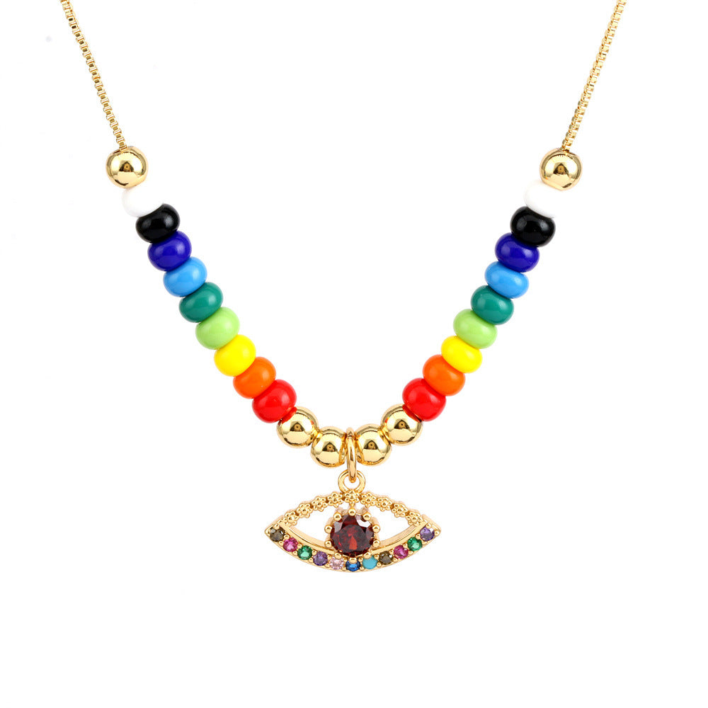 Collar con colgante de ojo mágico en forma de corazón de cobre al por mayor