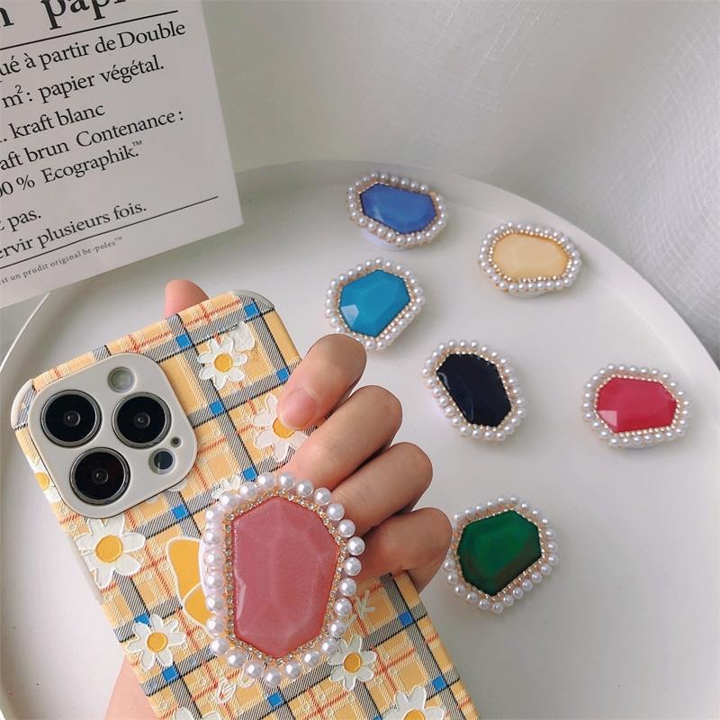 Venta al por mayor Soporte para teléfono móvil de perlas de piedras preciosas