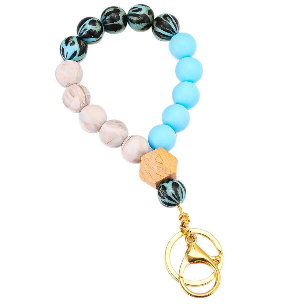 Llavero de muñeca con cuentas de madera de leopardo de leopardo.