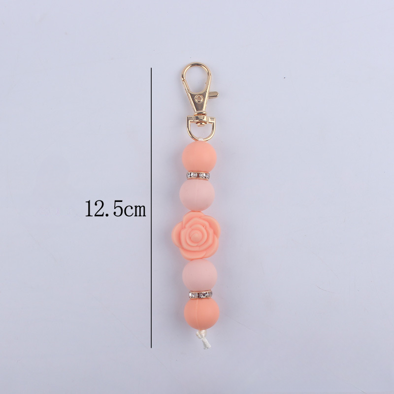 Llavero con cuentas de silicona rosa de doble cara al por mayor