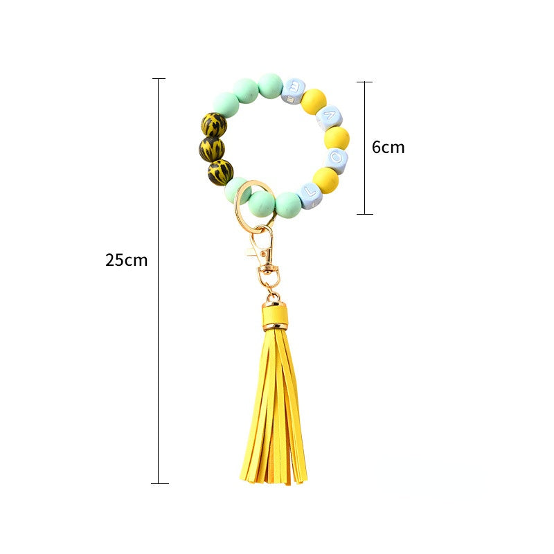 Venta al por mayor Llavero de muñeca con cuentas de silicona borla
