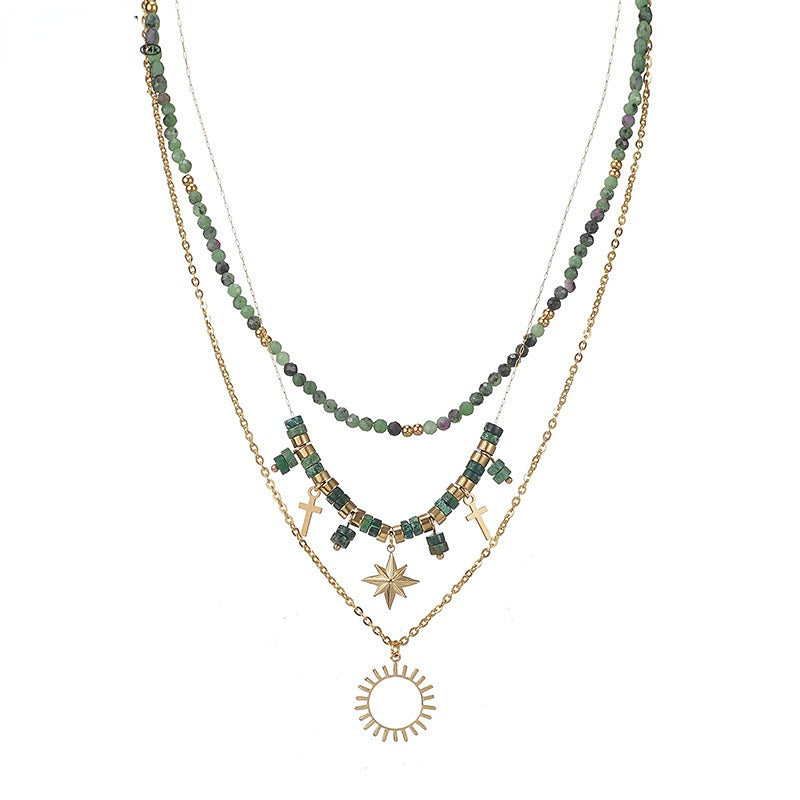 Venta al por mayor de titanio acero verde cuentas ocho Mangxing Cruz sol colgante collar