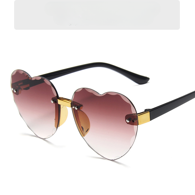 Gafas de sol para niños con diseño de corazón de melocotón degradado sin marco para PC al por mayor