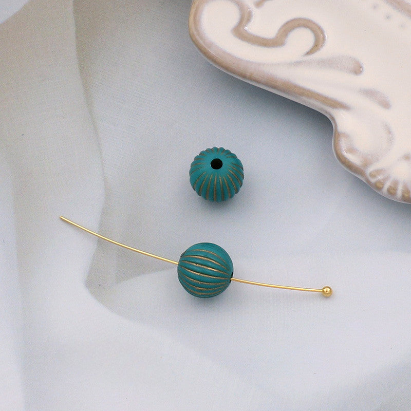 Wholesale of 10PCS Vintage Gold Relief Patterned Plastic Beads