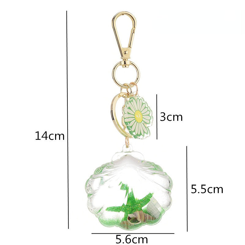 Venta al por mayor Llaveros flotantes de estrellas de mar aceitadas acrílicas