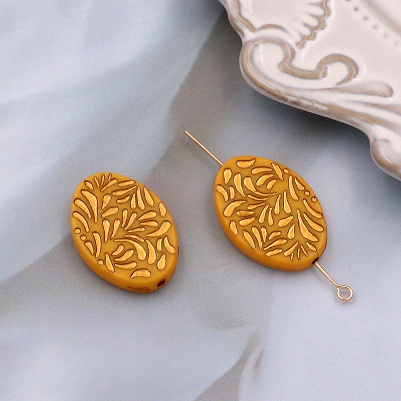 Wholesale of 10PCS Vintage Gold Relief Patterned Plastic Beads